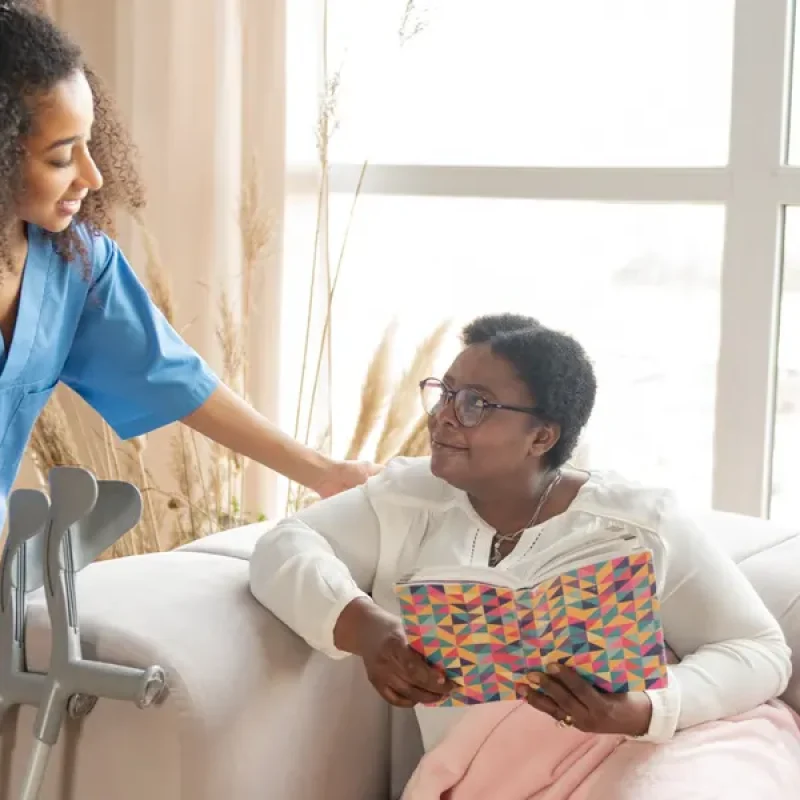 A Remedy Support caregiver smiling with a client